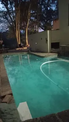 an empty swimming pool with a green hue at Makhonjwa Rose Barberton in Barberton