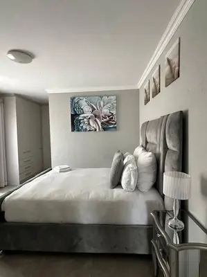 a bedroom with a large bed with pillows on it at LaRo in Boschrand