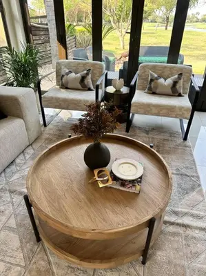 a living room with a wooden table and chairs at Luxury Escape - Pecanwood Golf Estate - Hartbeespoort in Hartbeespoort