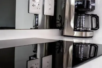 a counter with a coffee maker and a coffeemaker at Urban Luxe by Jules, Ellipse, Waterfall in Midrand