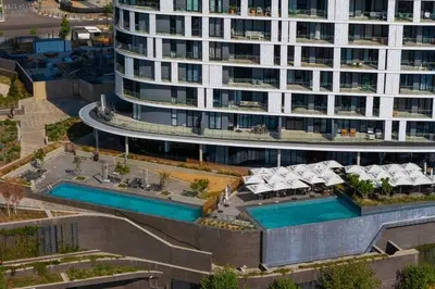 an aerial view of a building with a swimming pool at Urban Luxe by Jules, Ellipse, Waterfall in Midrand