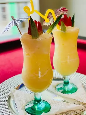 two cocktails sitting on top of a table at Debreeze guest lodge in Malelane