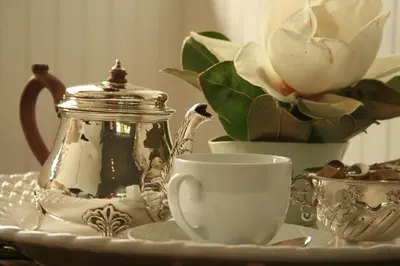 a table with a tea pot and a tea cup at Torburnlea Homestead Luxury Accommodation in Nelspruit