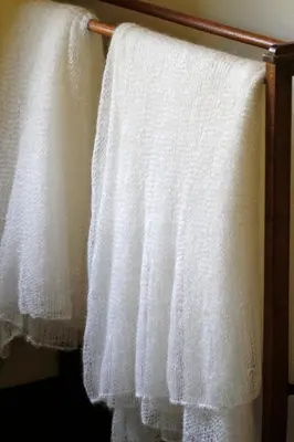 a group of white towels hanging on a towel rack at Torburnlea Homestead Luxury Accommodation in Nelspruit