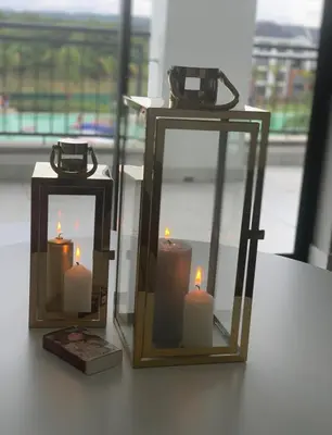 two candles and a mirror on a table at The Blyde Penthouse in Pretoria