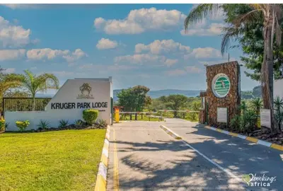 a sign for the ranger park lodge next to a road at Kruger Park Lodge, Mpumalanga Unit 424 in Hazyview