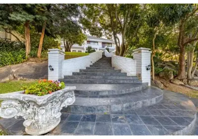 a set of stairs leading up to a house at Sheppard Boutique Hotel in Nelspruit
