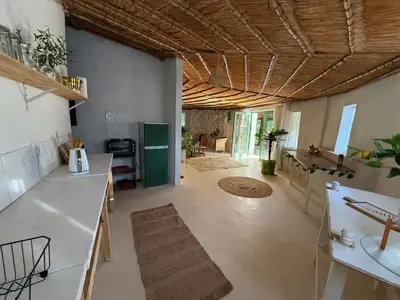 a room with a kitchen with a counter and a sink at Lemón Villa in Bela-Bela