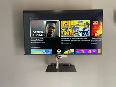 a flat screen tv hanging on a wall at Mukutsuri Luxury Apartments in Giyani