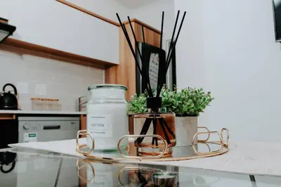 a kitchen counter with two jars and plants on it at The Blyde Lagoon Apartment in Pretoria