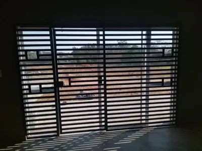 a large window with blinds on it in a room at 114 Zinnia in Midrand