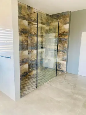 a shower with a glass door in a room at 114 Zinnia in Midrand