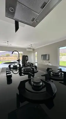 a conference room with black chairs and a large ceiling at CELONIA VILLA Euphoria 442 in Naboomspruit