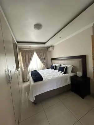 a bedroom with a large bed and a window at 3 Bed home Nelspruit Golden Crescent in Nelspruit