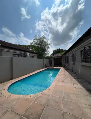 a swimming pool in the backyard of a house at 3 Bed home Nelspruit Golden Crescent in Nelspruit