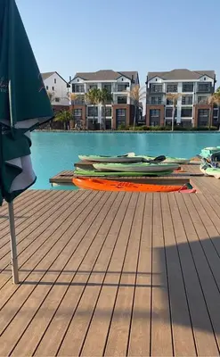 a deck with an umbrella next to a swimming pool at Affordable Luxury villa at the Blyde in Pretoria