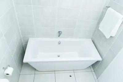 a white bathroom with a tub and a sink at Affordable Luxury villa at the Blyde in Pretoria