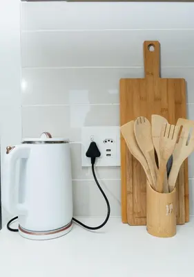 a kitchen counter with a toaster and wooden utensils at Affordable Luxury villa at the Blyde in Pretoria