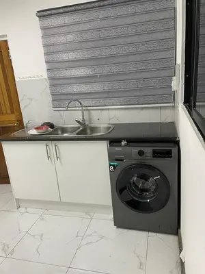a kitchen with a sink and a washing machine at Palma de Mallorca in Kempton Park