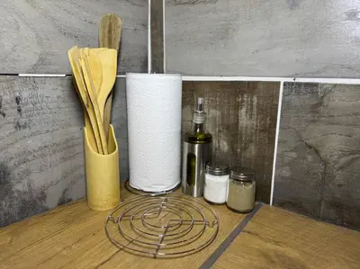 a shelf with a roll of toilet paper and a bottle at Spacious stay-in 2bedroom apartment in Kempton Park