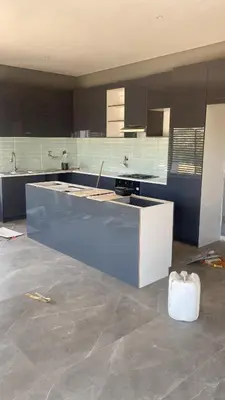 a kitchen being remodeled with a blue and white counter at 114 zinnia place in Midrand