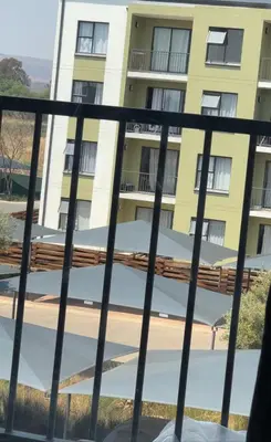 a view of a building from a balcony at Stay easy at green creek in Pretoria