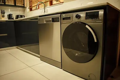a stainless steel washing machine in a kitchen at DUBE SAFARI LODGE at Kruger Park Lodge 505 in Hazyview