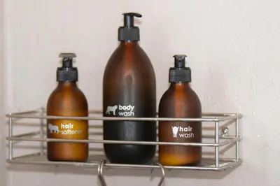 four bottles on a shelf in a wall at Mananga Bush Villa in Skukuza