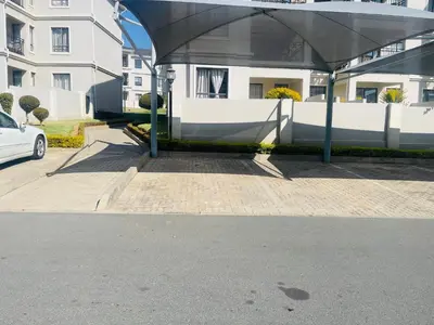 a white car parked in front of a building at 12th La Maison in Erand