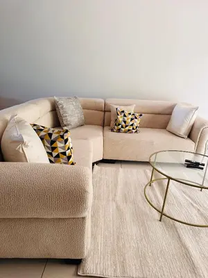a living room with a couch and a table at Tranquility in Erand