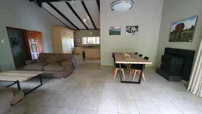 a living room with a couch and a table at DaGama Dam - White River - Kite - C11 in Swartfontein