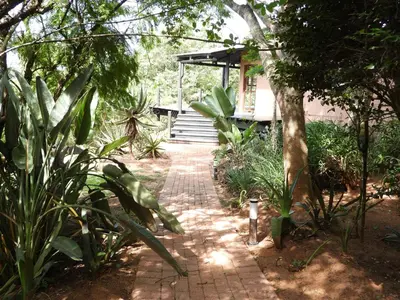 a brick walkway in front of a house at DaGama Dam - White River - Kite - C11 in Swartfontein