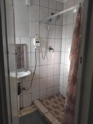 a bathroom with a shower and a sink at Angel Secure Unit in Pretoria