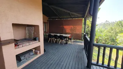a balcony of a house with a table and chairs at DaGama Dam - White River - Martial Eagle - C23 in Swartfontein