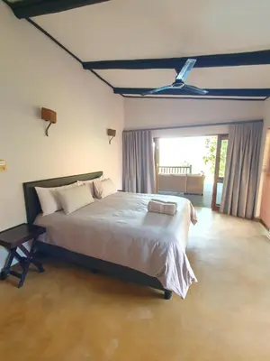 a bedroom with a large bed with a ceiling at DaGama Dam - White River - Martial Eagle - C23 in Swartfontein