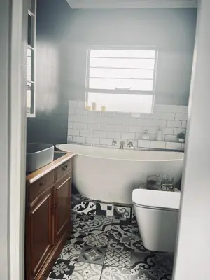 a bathroom with a tub and a toilet and a sink at Anga Spaces in Duvhapark