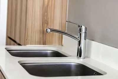 a kitchen sink with a faucet on a counter at The Blyde Tranquil Escapes in Pretoria