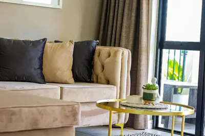 a living room with a couch and a table at The Blyde Tranquil Escapes in Pretoria