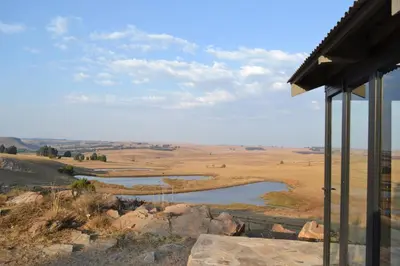 a view of a river from a house at Meadow Mist - Self Catering Unit in Dullstroom