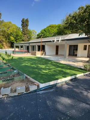a house with a yard with a yard at Limewood super Deluxe in Sandton