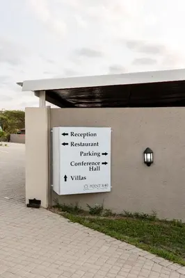 a sign on the side of a building at Point R40 Lodge - Conference, Self Catering & Spa in Nelspruit