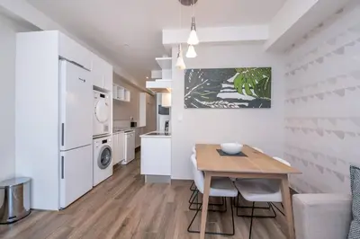 a kitchen with a table and a dining room at 1 bedroom Apartment in Pretoria