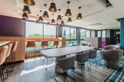 a dining room with a table and chairs at 1 bedroom Apartment in Pretoria