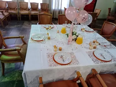 a table with balloons and plates and balloons on it at Prospectus Accommodation in Northam