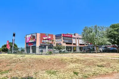 a building with a fence in front of it at Secured Home in Centurion