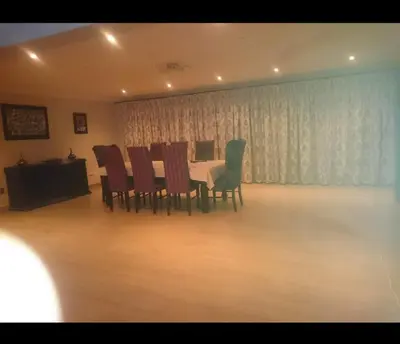 a dining room with a table and chairs at Tranquil Space in Nelspruit