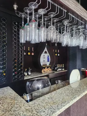 a bar with a sink and wine glasses at Blue Valley Golf Estate in Centurion