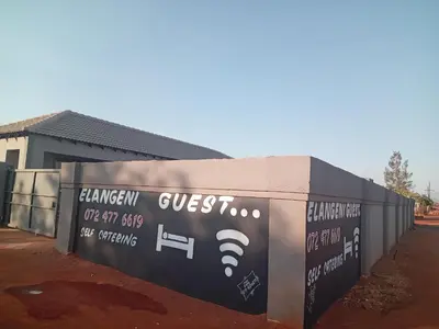 a wall with a sign that saysquest on it at Elangeni Guest House in Mahubahuba