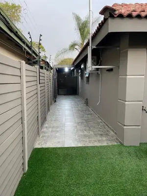 a hallway of a house with green grass at 9 on Burger Blue Waters in Polokwane