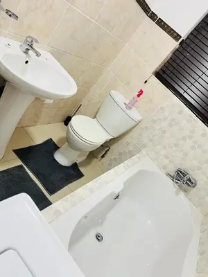 a bathroom with a white toilet and a sink at 9 on Burger Blue Waters in Polokwane